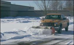 Plow truck plowing snow
